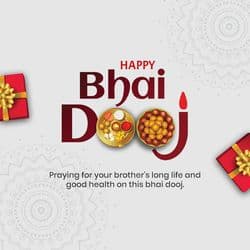 Brother and sister hugging on Bhai Dooj with diya and flowers